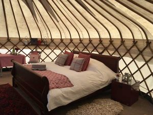 Emperor sized sleigh bed at Devon Yurt Holidays
