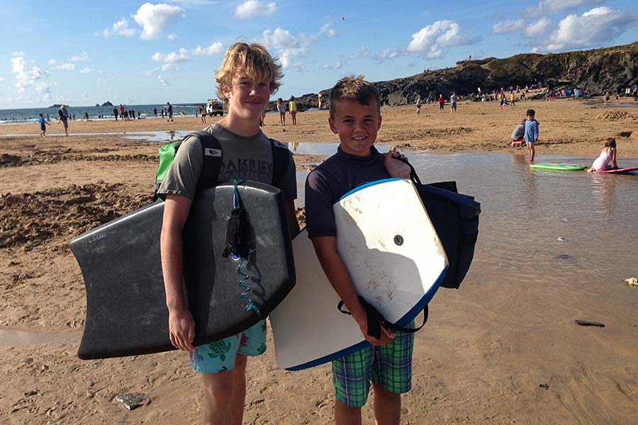 Two boys with body boards in Cornwall