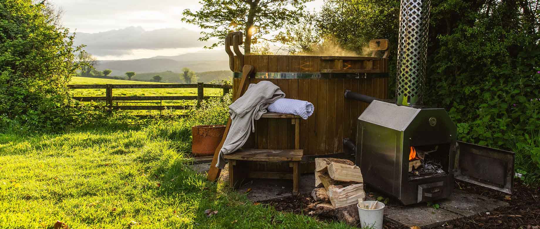 Great Links hot tub with views across the field to Dartmoor
