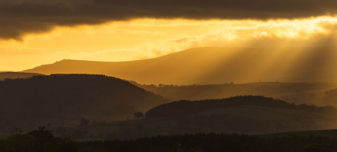 Sunrise across the Dartmoor hills from Great Links Yurt