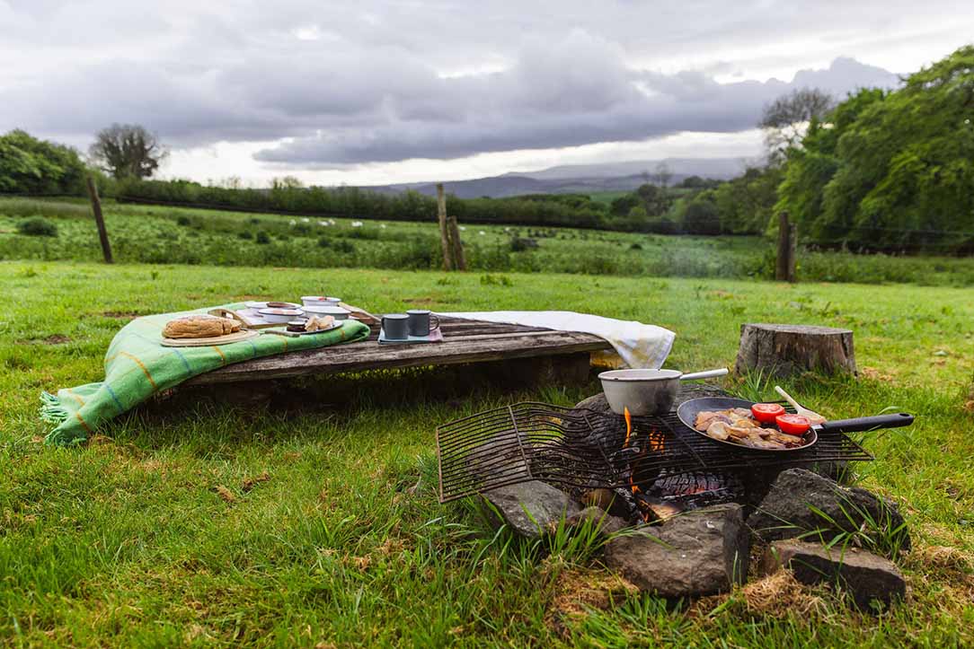 Cooking over an open fire with views across Dartmoor
